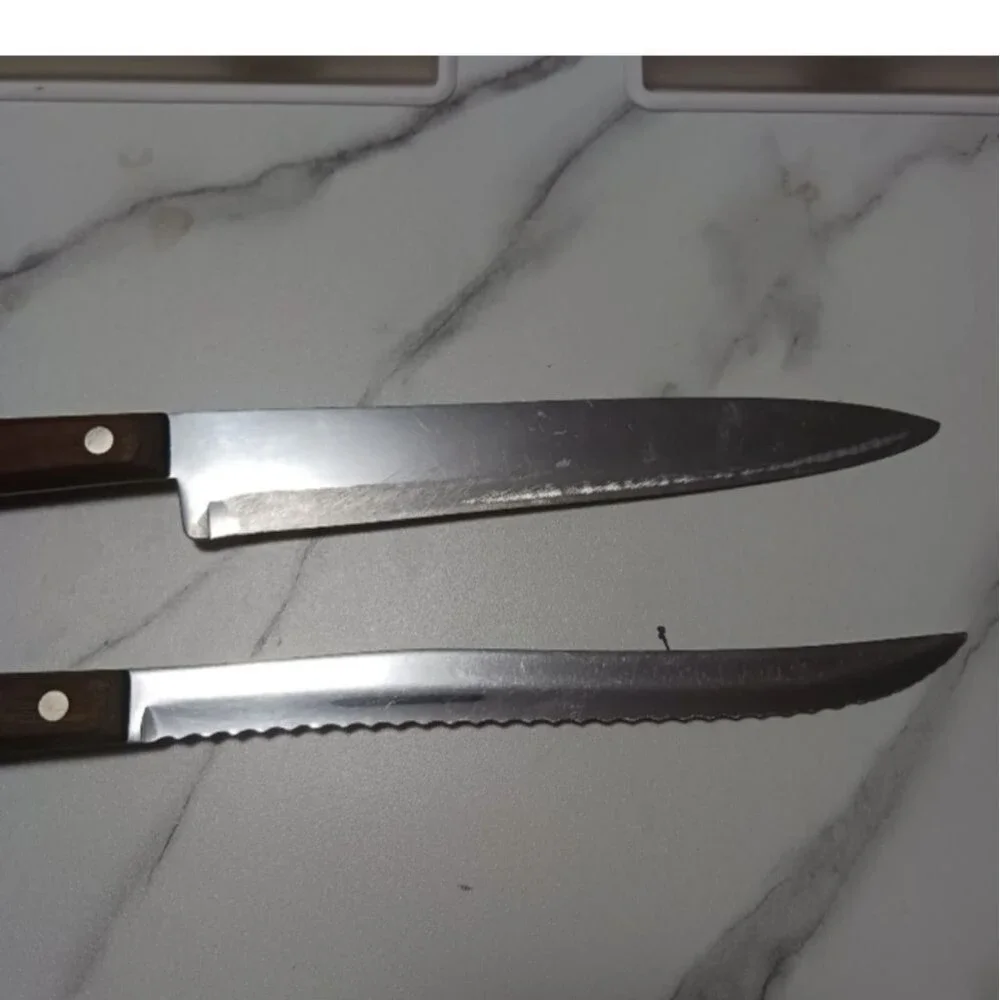 Pair of stainless steel Knives by Flint made in USA Surface scratches Partial